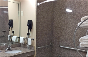 Vanity unit, mirror, hair dryer, towel rail with towels