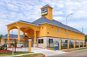 Hotel entrance with canopied drive through, two story building