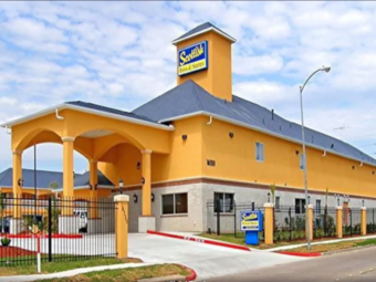 Hotel entrance with canopied drive through, two story building