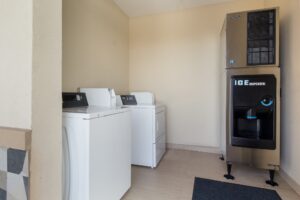 Coin operated guest washing machine and dryer, ice machine dispenser, tiled flooring
