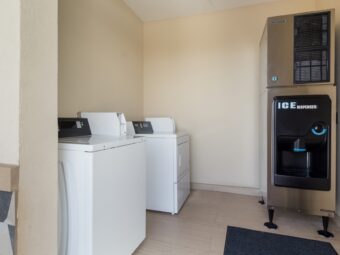 Coin operated guest washing machine and dryer, ice machine dispenser, tiled flooring