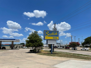 Brand signage, gas station, trees