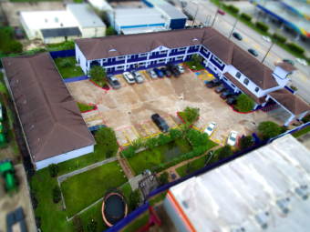 Arial view of hotel buildings, landscaping and parking areas