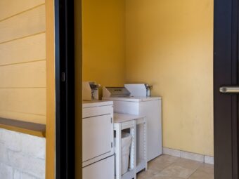 Coin operated guest washing machine and dryer, tiled flooring