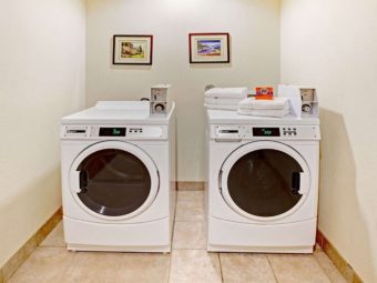 Coin operated washer and dryer, art images, tiled flooring