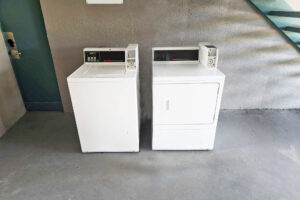 Coin operated washing machine and dryer for guest use