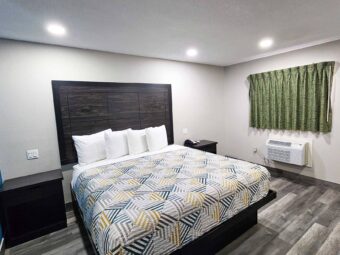 King bed, night stands with telephone, laminate flooring