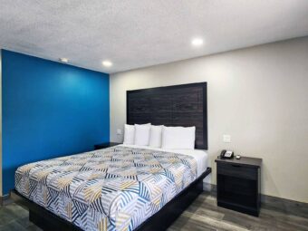 King bed, night stands with telephone, laminate flooring