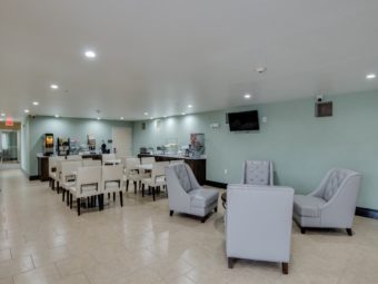 Easy chairs, breakfast seating and tables, breakfast display counters, tiled flooring